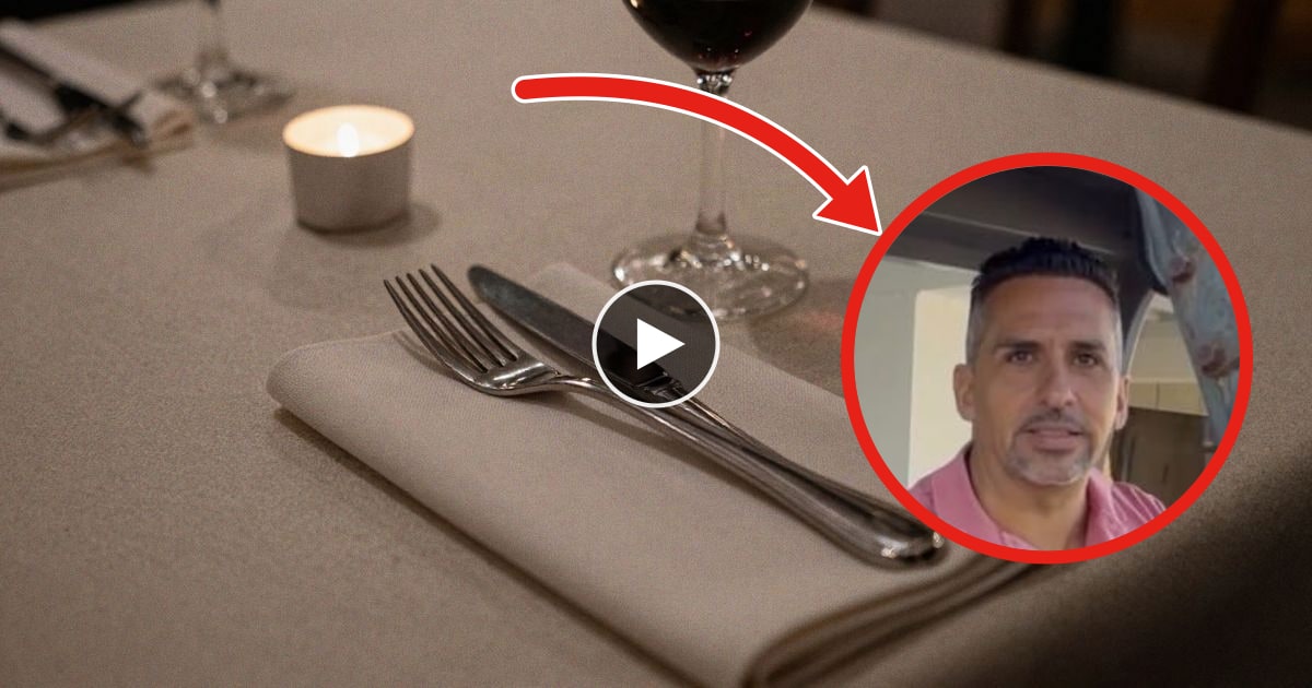 Imagen ilustrativa: detalle de una mesa de restaurante con mantelería, cubiertos y una copa de vino